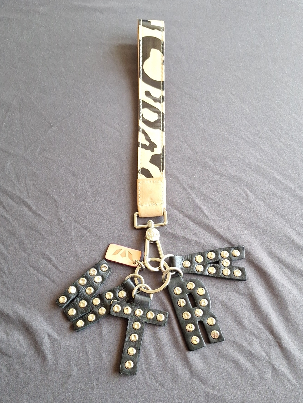 Consuela MTRA Black Studded Letter Bag Charm with Wrist Strap